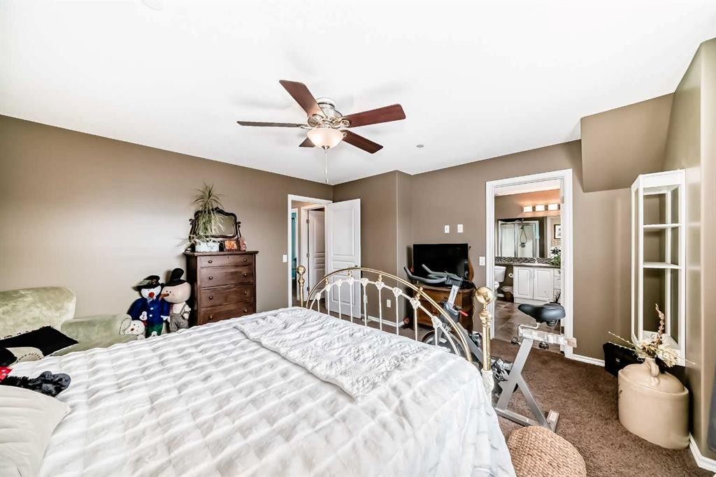 20 Mackenzie, Carstairs, AB - Indoor Photo Showing Bedroom