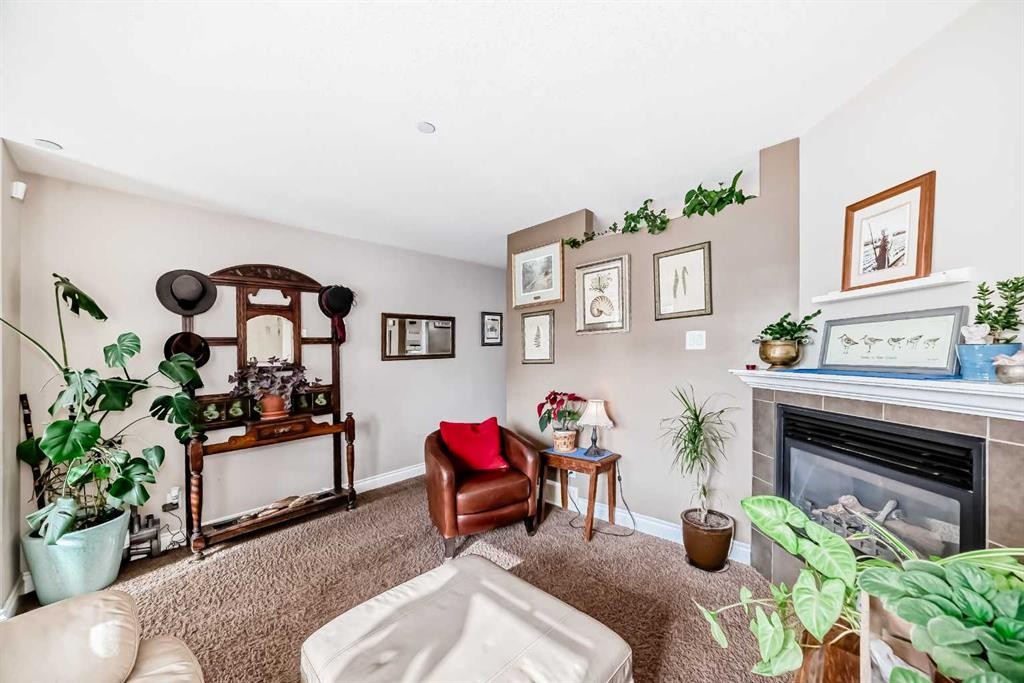 20 Mackenzie, Carstairs, AB - Indoor With Fireplace