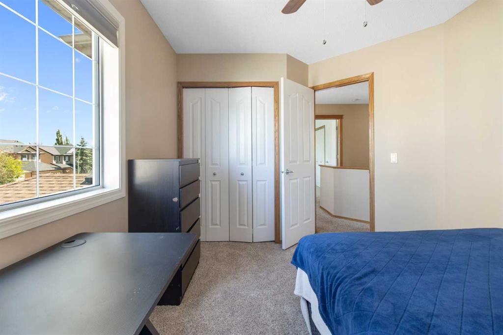 235 Everwillow Close Sw, Calgary, AB - Indoor Photo Showing Bedroom