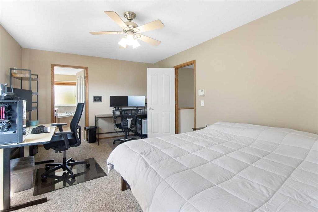 235 Everwillow Close Sw, Calgary, AB - Indoor Photo Showing Bedroom