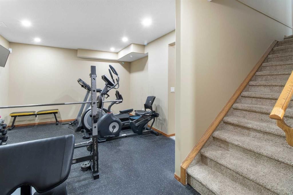 235 Everwillow Close Sw, Calgary, AB - Indoor Photo Showing Gym Room