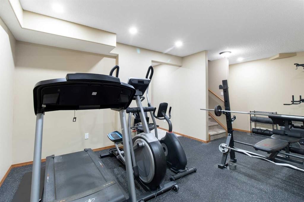 235 Everwillow Close Sw, Calgary, AB - Indoor Photo Showing Gym Room