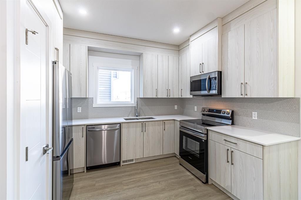 304 Cornerbrook Drive Ne, Calgary, AB - Indoor Photo Showing Kitchen With Double Sink