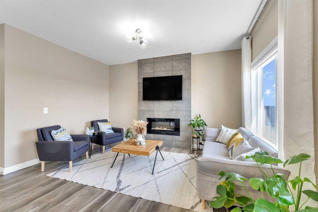 521 Corner Meadows Way Ne, Calgary, AB - Indoor Photo Showing Living Room With Fireplace