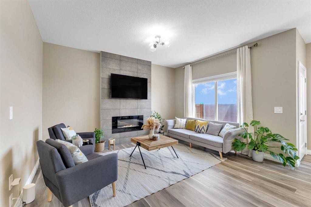 521 Corner Meadows Way Ne, Calgary, AB - Indoor Photo Showing Living Room With Fireplace
