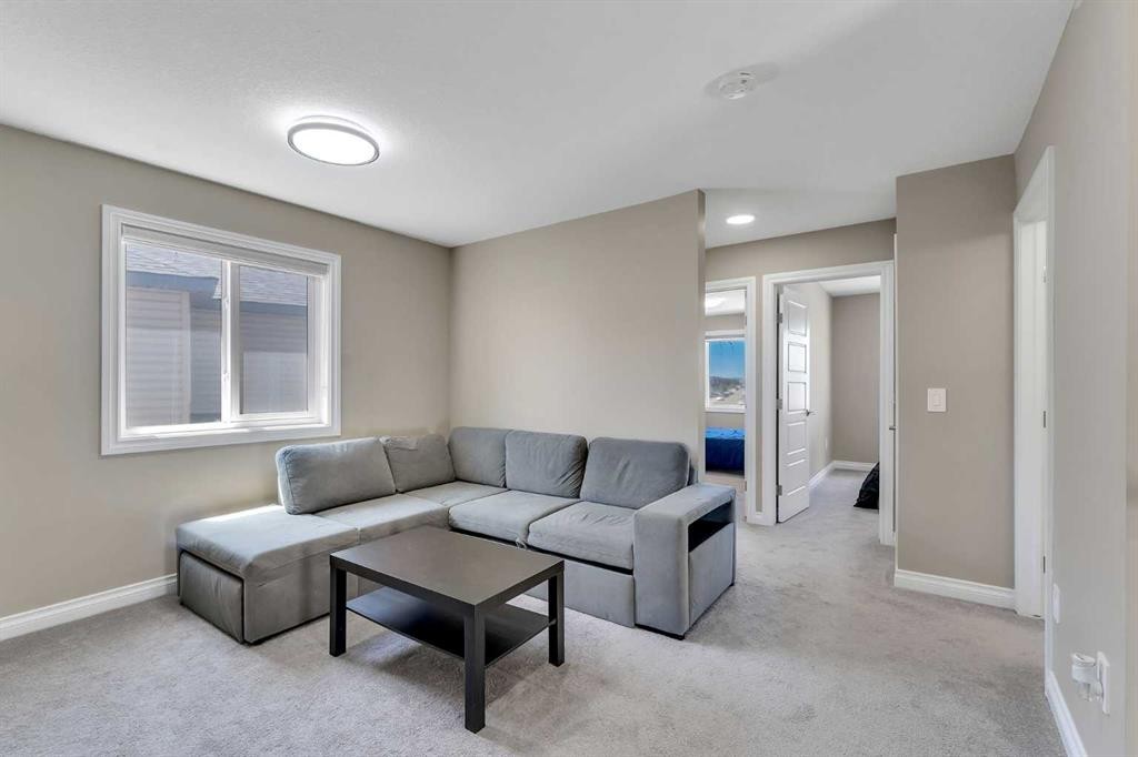 521 Corner Meadows Way Ne, Calgary, AB - Indoor Photo Showing Living Room