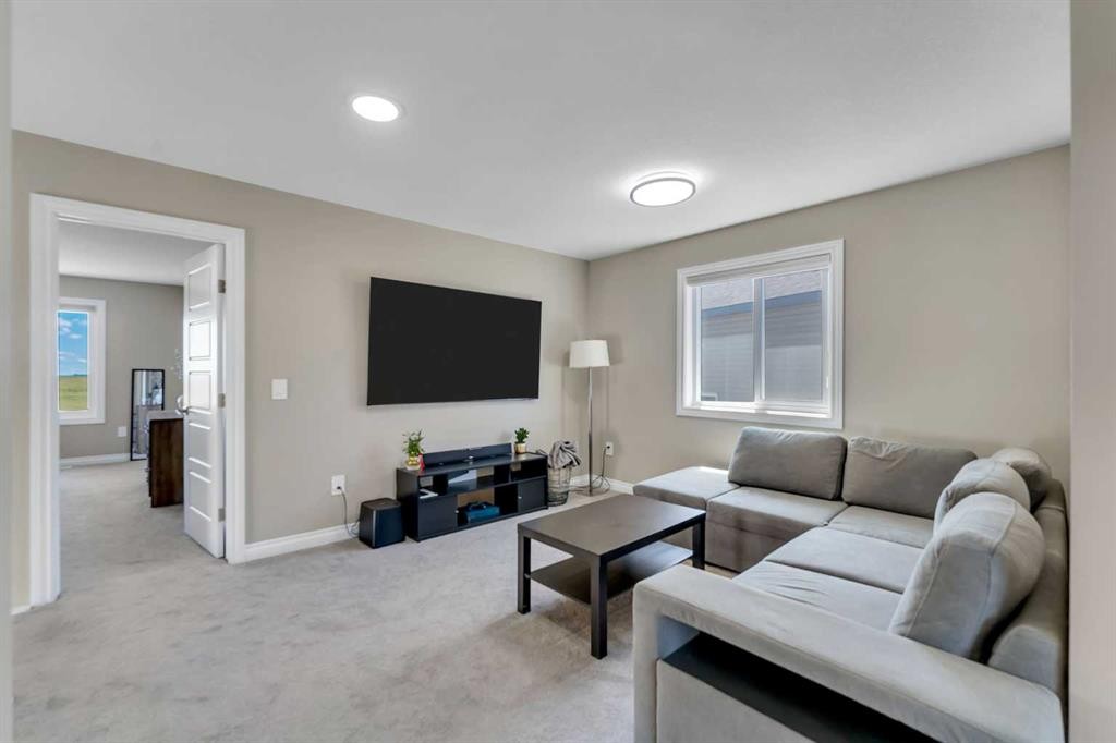 521 Corner Meadows Way Ne, Calgary, AB - Indoor Photo Showing Living Room