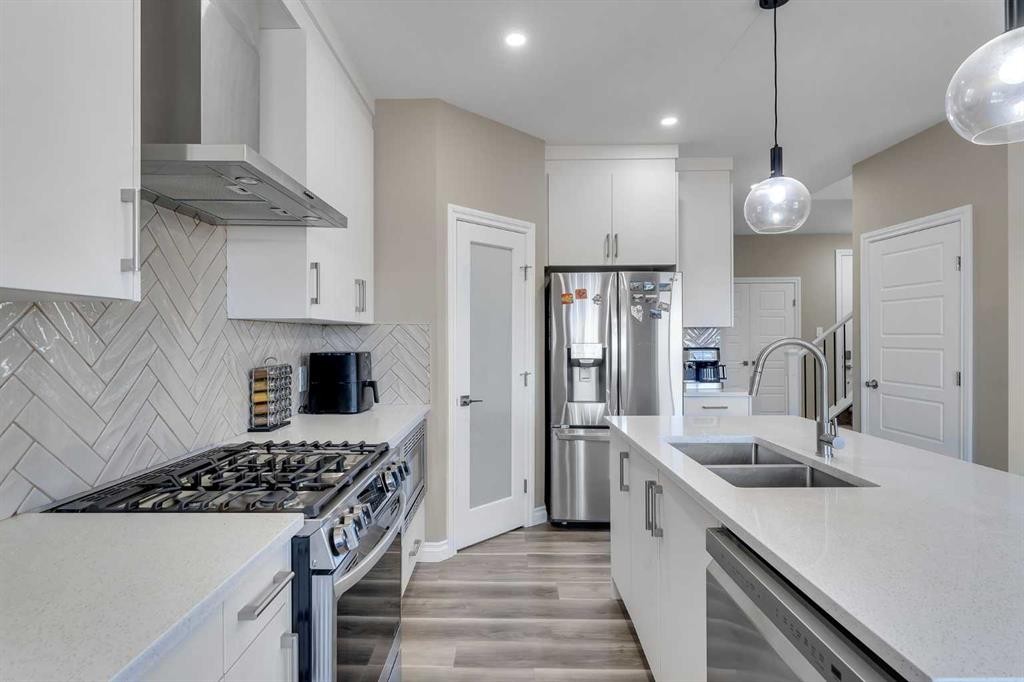 521 Corner Meadows Way Ne, Calgary, AB - Indoor Photo Showing Kitchen With Stainless Steel Kitchen With Double Sink With Upgraded Kitchen
