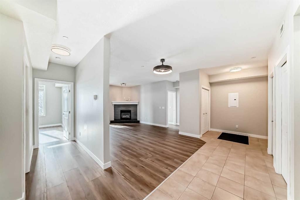 110-1005A Westmount Drive, Strathmore, AB - Indoor With Fireplace