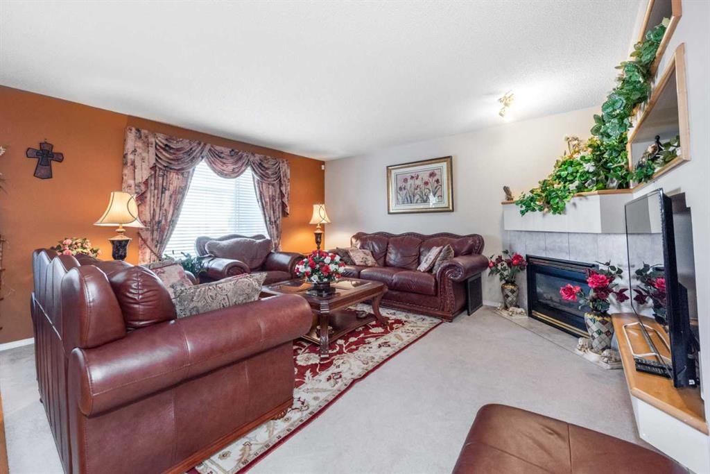 26 Citadel Crest Link Nw, Calgary, AB - Indoor Photo Showing Living Room With Fireplace