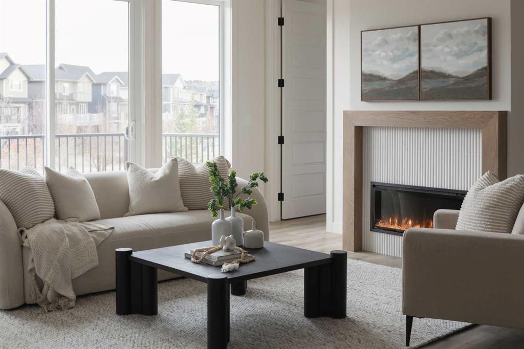 88 Sunrise Heath, Cochrane, AB - Indoor Photo Showing Living Room With Fireplace