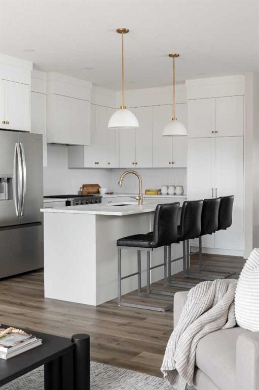 88 Sunrise Heath, Cochrane, AB - Indoor Photo Showing Kitchen With Upgraded Kitchen