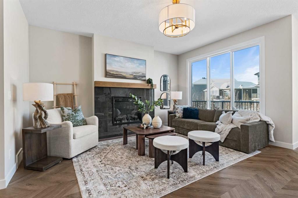 47 Sundown Crescent, Cochrane, AB - Indoor Photo Showing Living Room With Fireplace