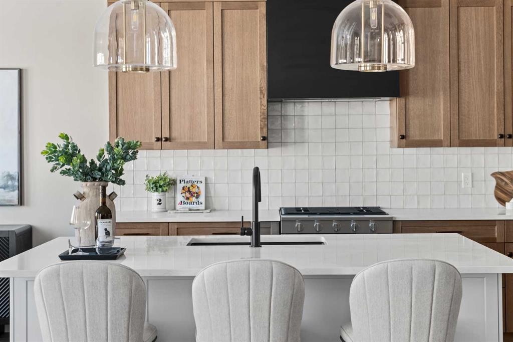 47 Sundown Crescent, Cochrane, AB - Indoor Photo Showing Kitchen With Upgraded Kitchen