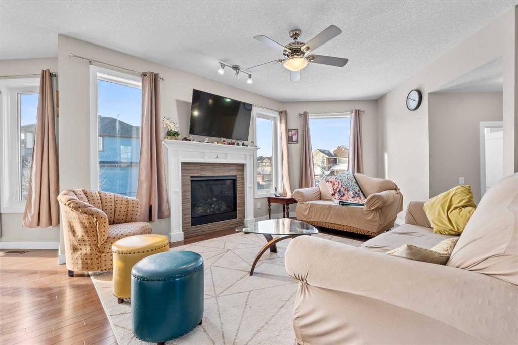 8487 Saddlebrook Drive Ne, Calgary, AB - Indoor Photo Showing Living Room With Fireplace
