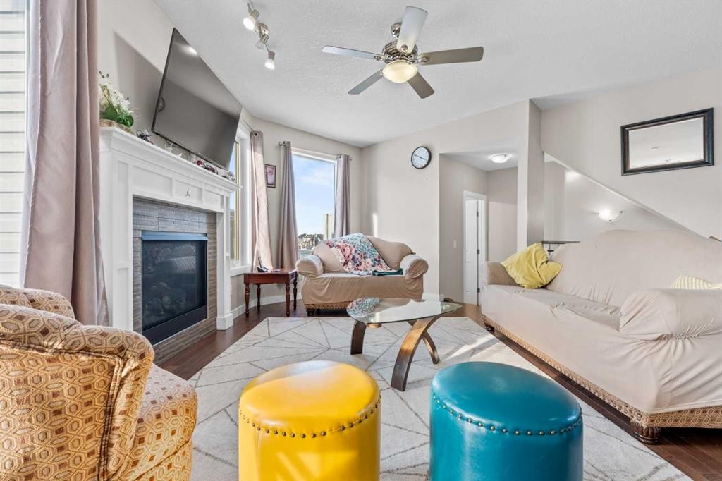 8487 Saddlebrook Drive Ne, Calgary, AB - Indoor Photo Showing Living Room With Fireplace