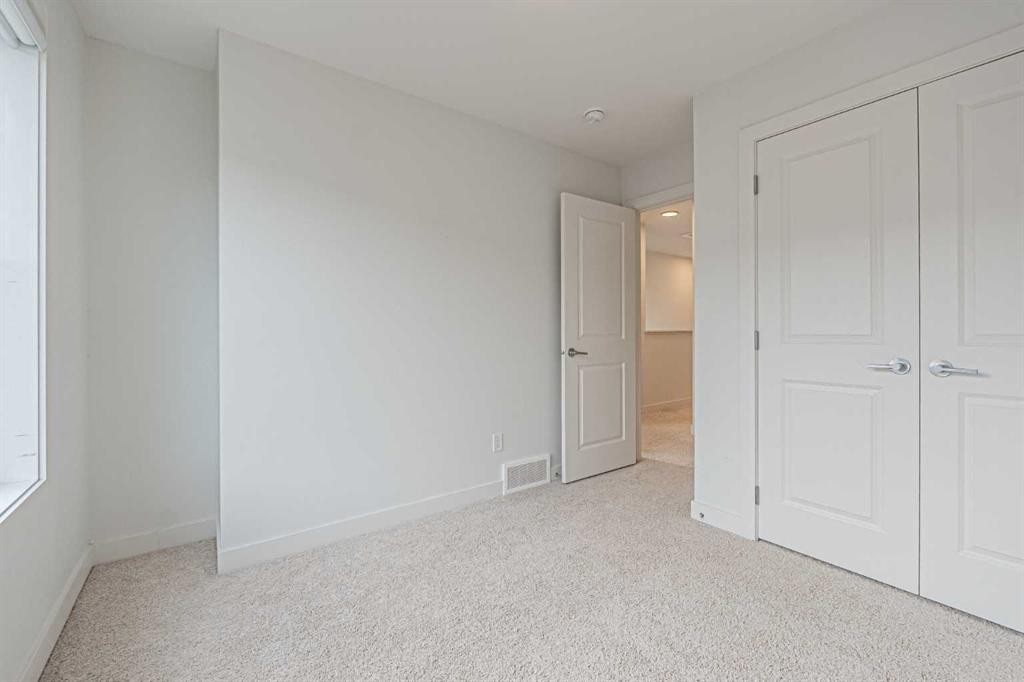 101-550 Seton Circle Se, Calgary, AB - Indoor Photo Showing Other Room