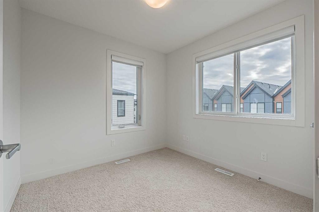 101-550 Seton Circle Se, Calgary, AB - Indoor Photo Showing Other Room