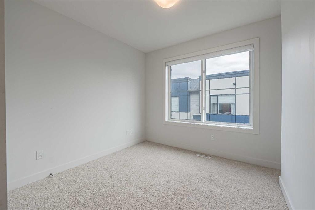 101-550 Seton Circle Se, Calgary, AB - Indoor Photo Showing Other Room