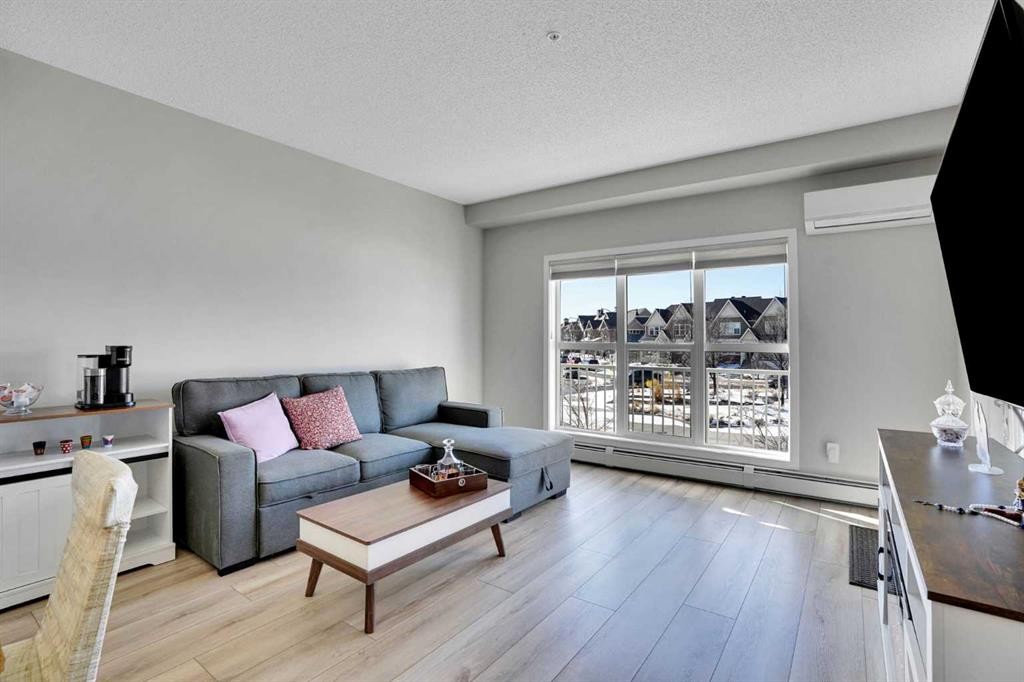 208-402 Marquis Lane Se, Calgary, AB - Indoor Photo Showing Living Room