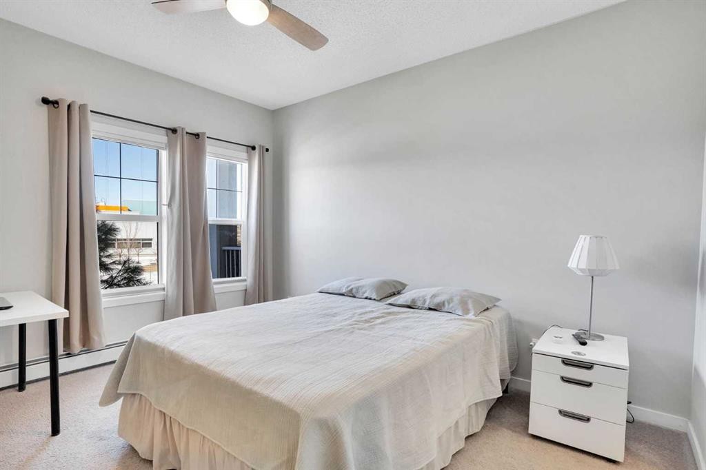 208-402 Marquis Lane Se, Calgary, AB - Indoor Photo Showing Bedroom
