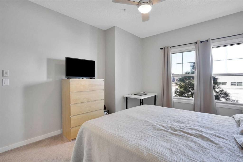 208-402 Marquis Lane Se, Calgary, AB - Indoor Photo Showing Bedroom