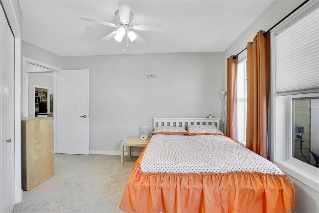 208-402 Marquis Lane Se, Calgary, AB - Indoor Photo Showing Bedroom