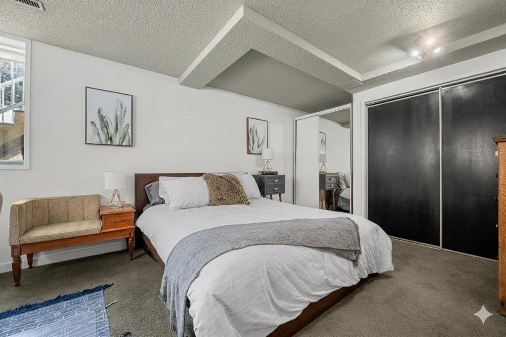 55 Coach Gate Way Sw, Calgary, AB - Indoor Photo Showing Bedroom