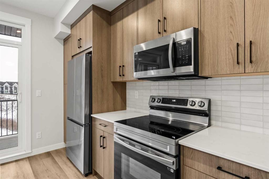 402-50 Sage Hill Nw, Calgary, AB - Indoor Photo Showing Kitchen With Stainless Steel Kitchen