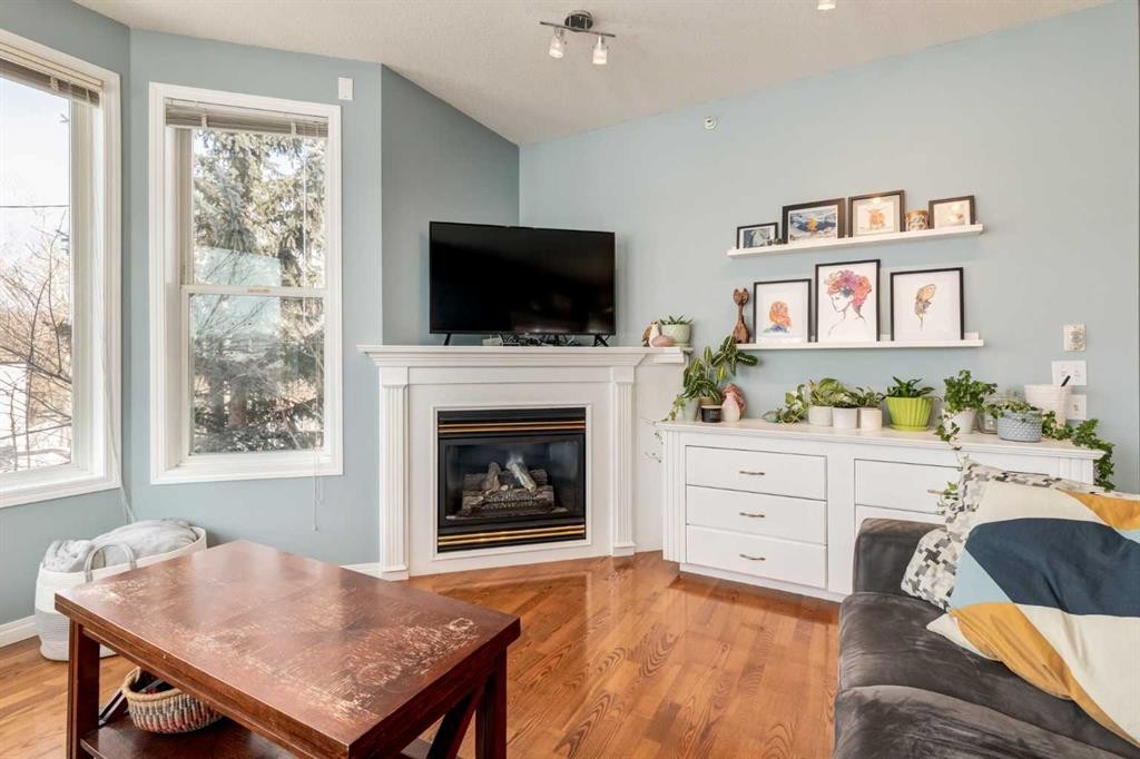 310-2134 Kensington Road Nw, Calgary, AB - Indoor Photo Showing Living Room With Fireplace