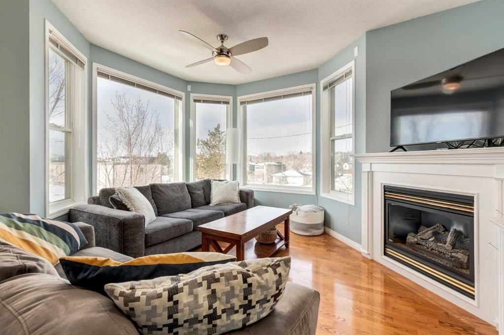 310-2134 Kensington Road Nw, Calgary, AB - Indoor Photo Showing Living Room With Fireplace