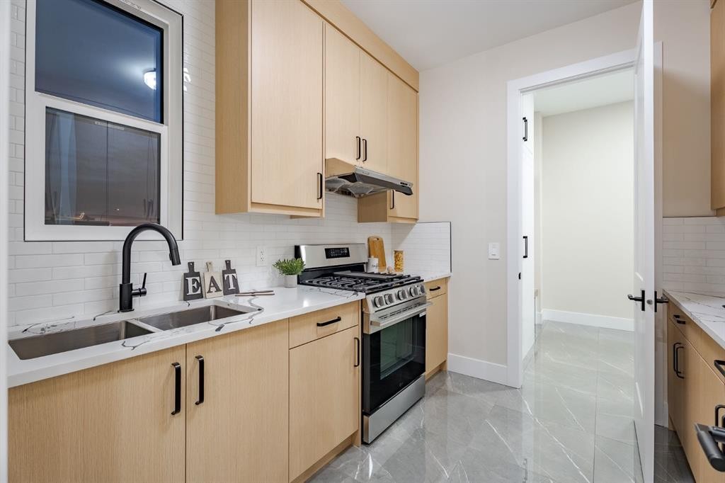 2057 Waterbury Road, Chestermere, AB - Indoor Photo Showing Kitchen With Double Sink With Upgraded Kitchen
