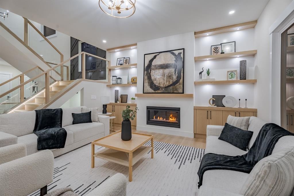 2057 Waterbury Road, Chestermere, AB - Indoor Photo Showing Living Room With Fireplace
