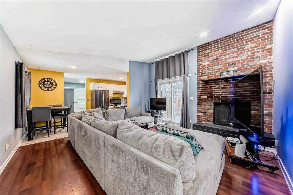 644 Spring Haven Court Se, Airdrie, AB - Indoor Photo Showing Living Room With Fireplace