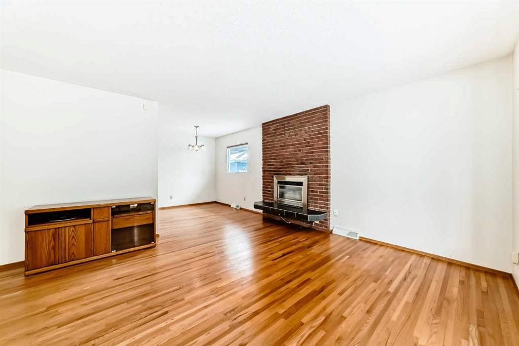 3408 Boulton Road Nw, Calgary, AB - Indoor Photo Showing Other Room With Fireplace