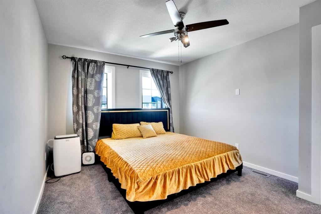 47 Lake Street, Rural Red Deer County, AB - Indoor Photo Showing Bedroom