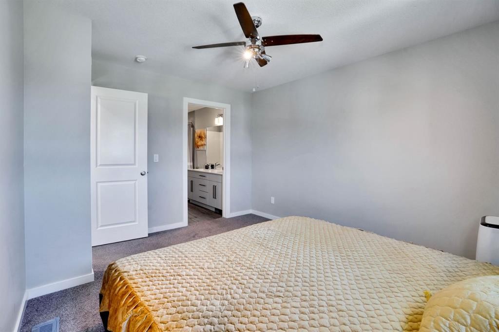 47 Lake Street, Rural Red Deer County, AB - Indoor Photo Showing Bedroom
