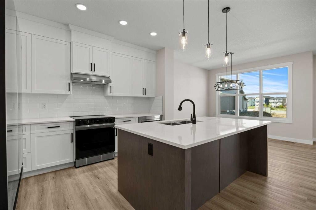 462 Kinniburgh Loop, Chestermere, AB - Indoor Photo Showing Kitchen With Upgraded Kitchen