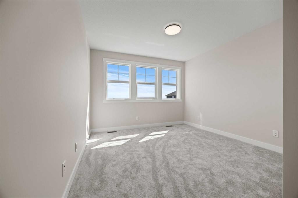 462 Kinniburgh Loop, Chestermere, AB - Indoor Photo Showing Other Room