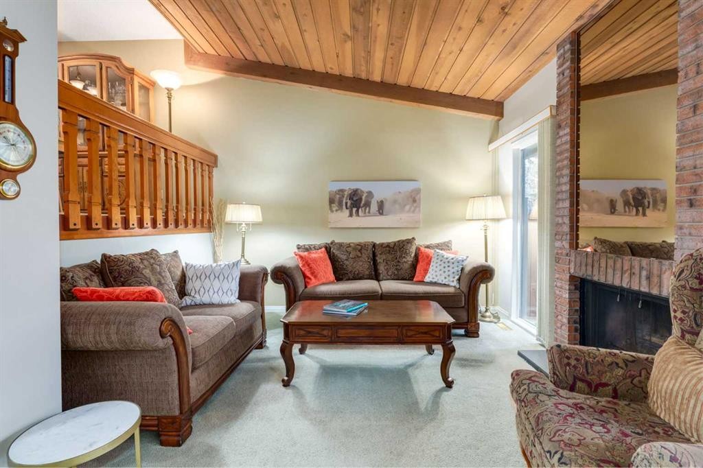 59-10030 Oakmoor Way Sw, Calgary, AB - Indoor Photo Showing Living Room With Fireplace