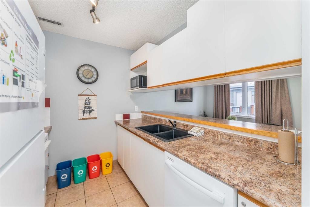 140-1202 Bow Valley Trail, Canmore, AB - Indoor Photo Showing Kitchen With Double Sink