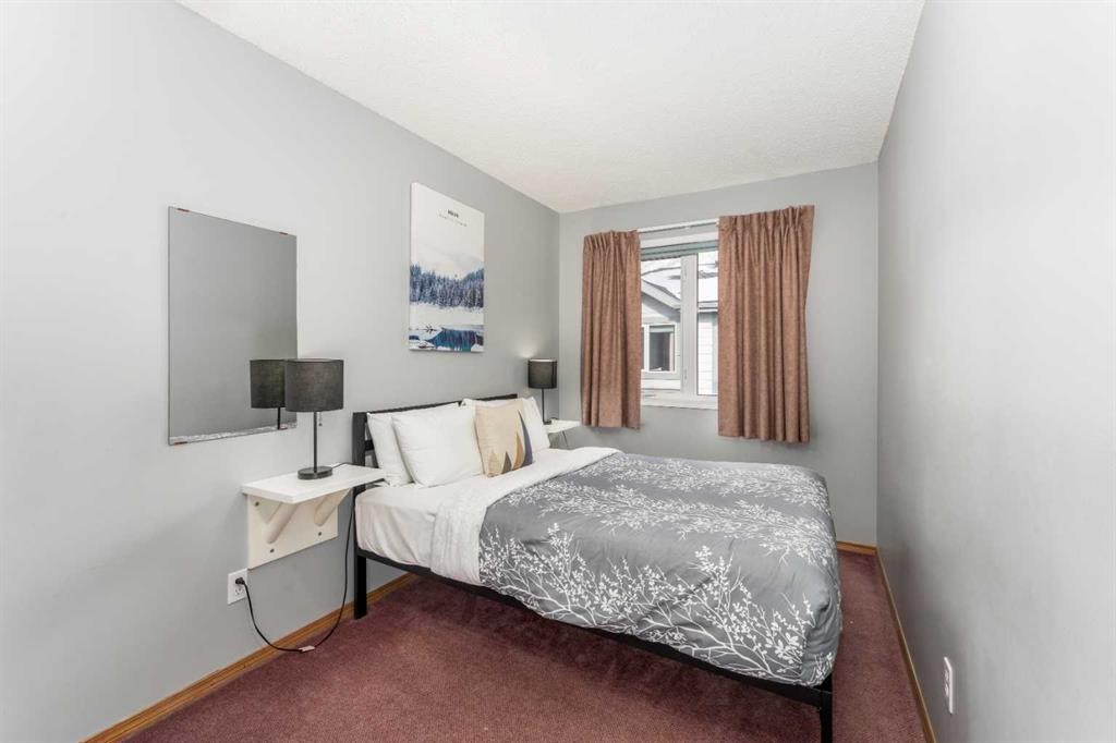 140-1202 Bow Valley Trail, Canmore, AB - Indoor Photo Showing Bedroom