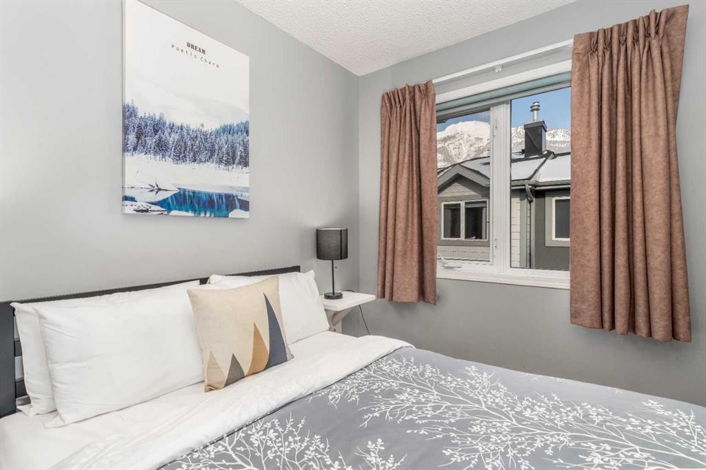 140-1202 Bow Valley Trail, Canmore, AB - Indoor Photo Showing Bedroom