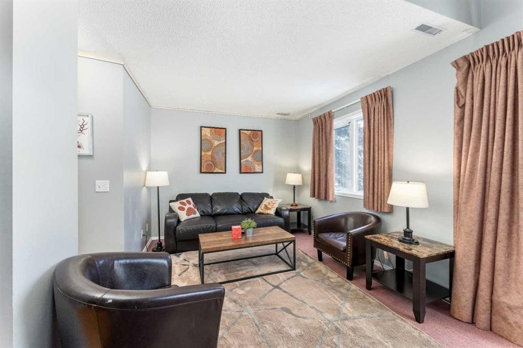 140-1202 Bow Valley Trail, Canmore, AB - Indoor Photo Showing Living Room