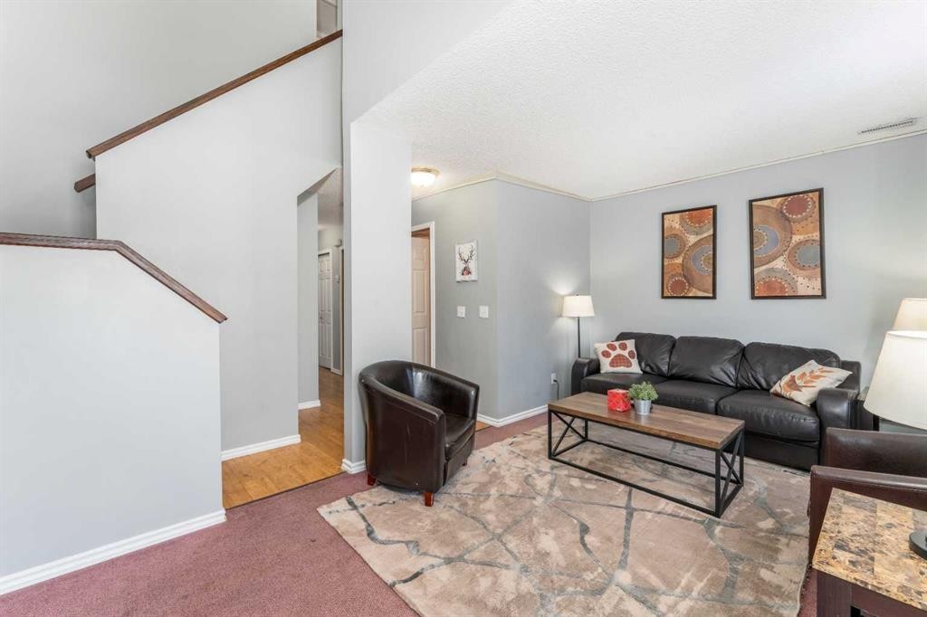 140-1202 Bow Valley Trail, Canmore, AB - Indoor Photo Showing Living Room