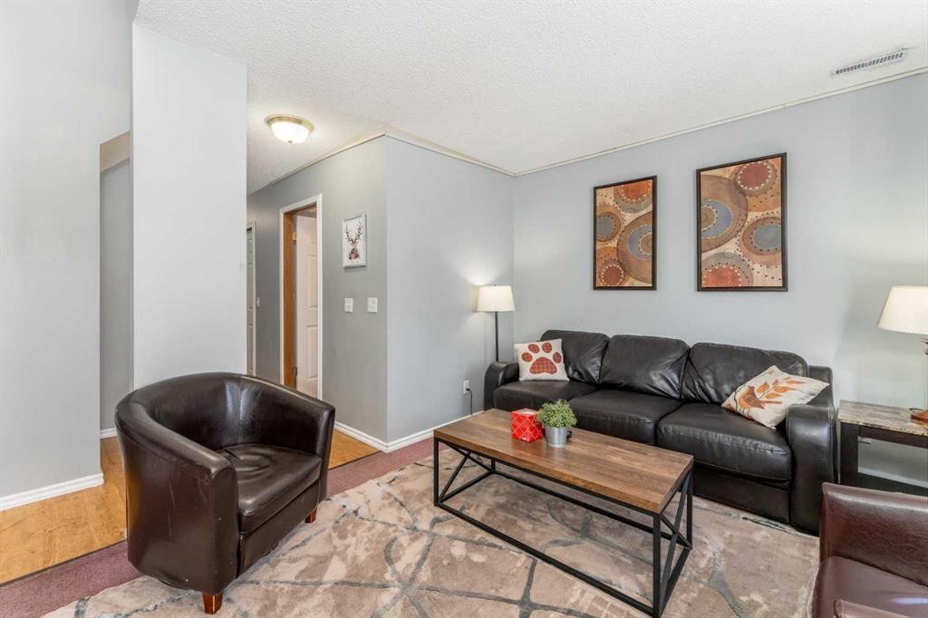 140-1202 Bow Valley Trail, Canmore, AB - Indoor Photo Showing Living Room