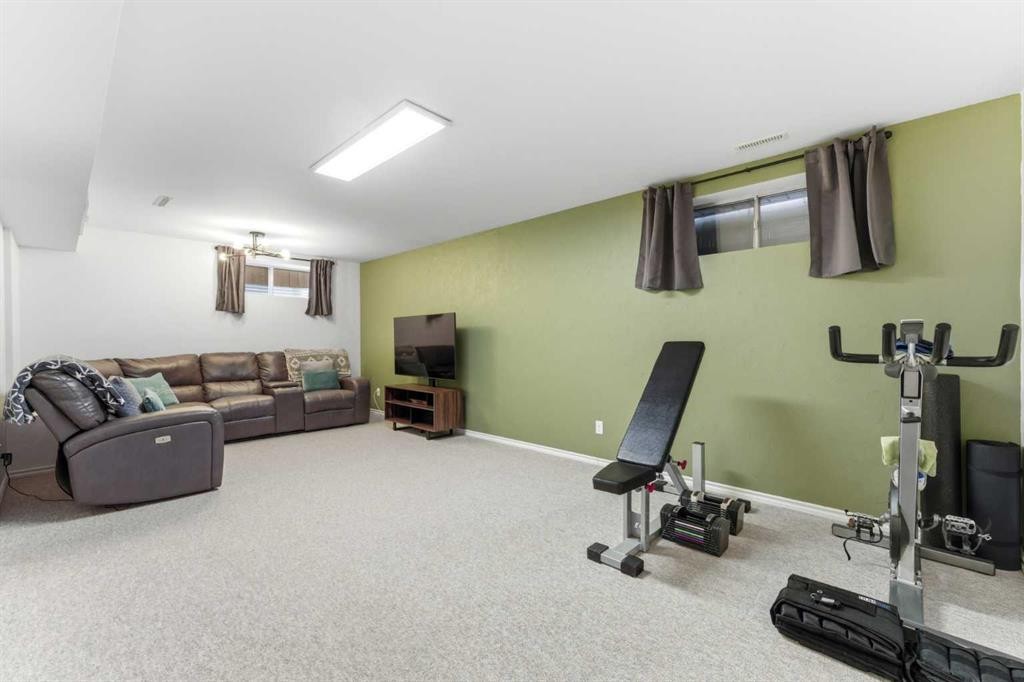 84 Mt Apex Green Se, Calgary, AB - Indoor Photo Showing Gym Room