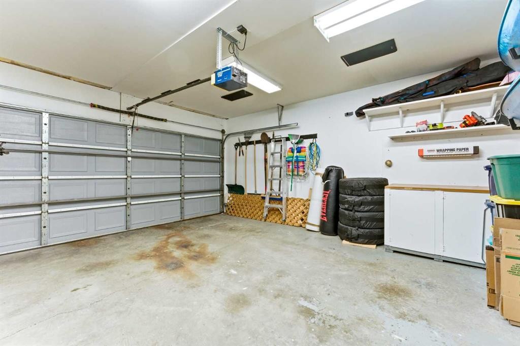84 Mt Apex Green Se, Calgary, AB - Indoor Photo Showing Garage