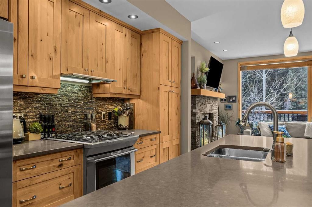 22 Streamside Lane, Canmore, AB - Indoor Photo Showing Kitchen With Double Sink
