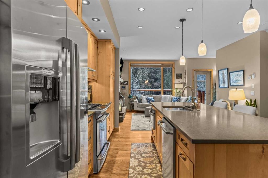 22 Streamside Lane, Canmore, AB - Indoor Photo Showing Kitchen With Double Sink With Upgraded Kitchen